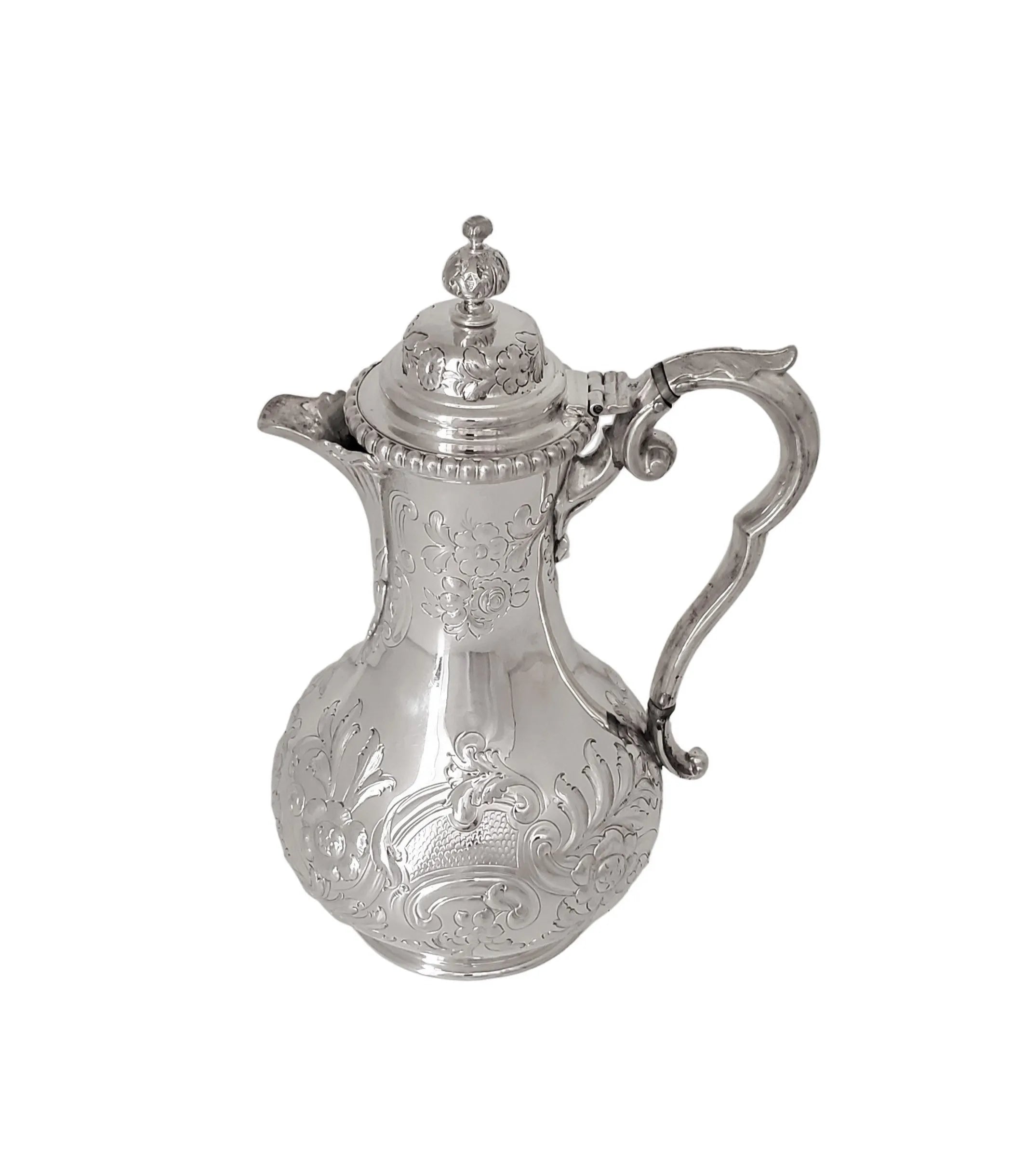 Antique embossed English silver plate coffee jug with floral details and a lid, around 1860.
