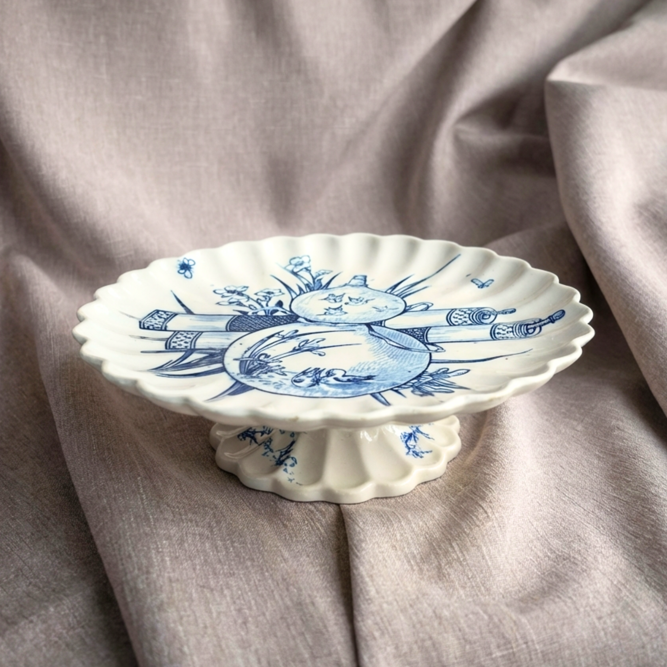 Rare 1880 Copeland pedestal comports in cobalt Japonisme design on a gray fabric background
