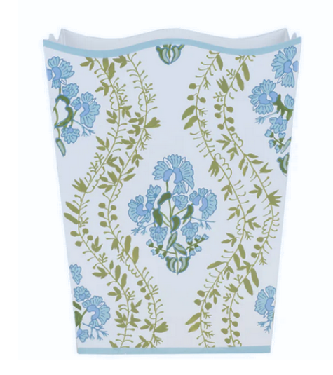 Wastepaper basket / trash bin with blue floral pattern on a white background