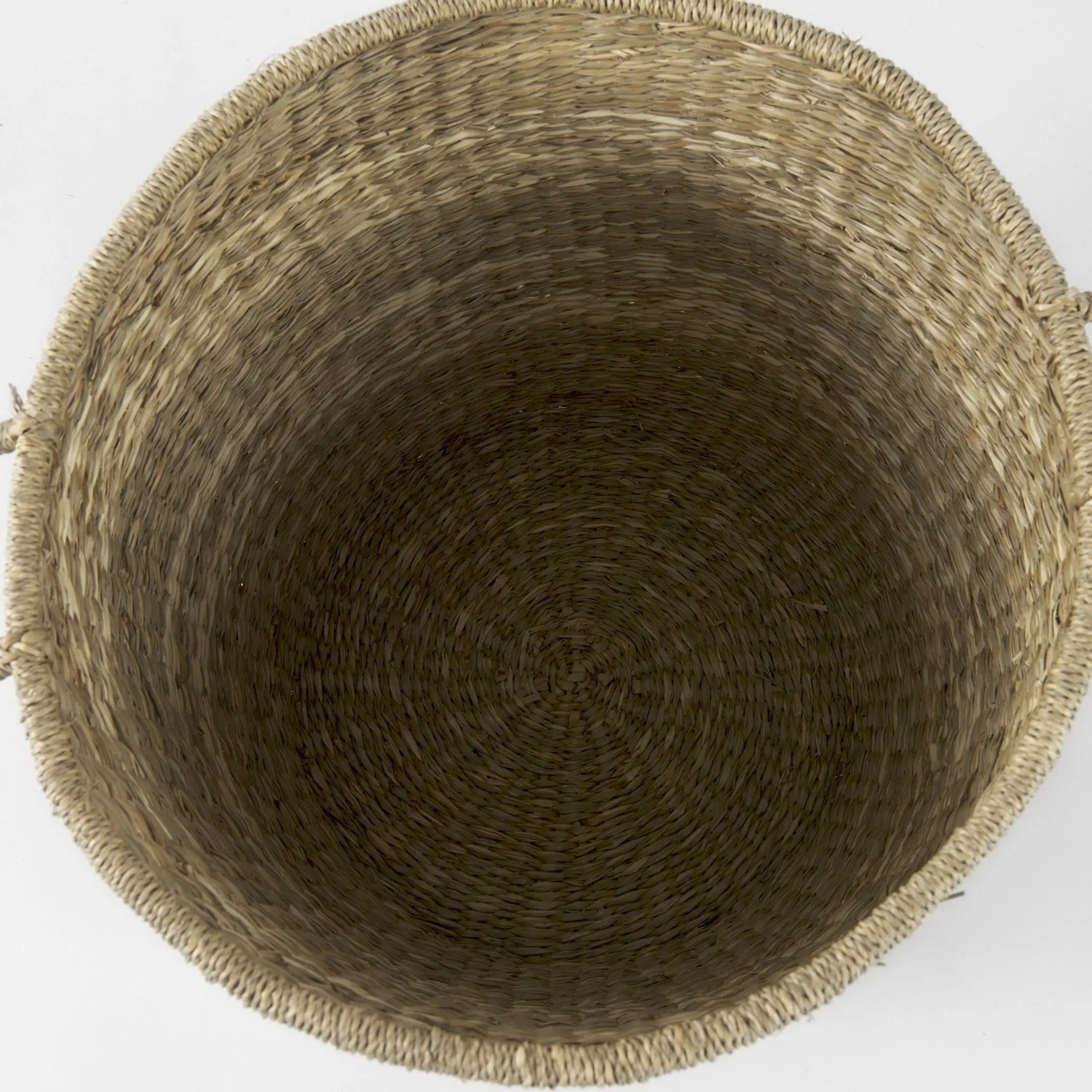 Close-up of a woven basket on a white background