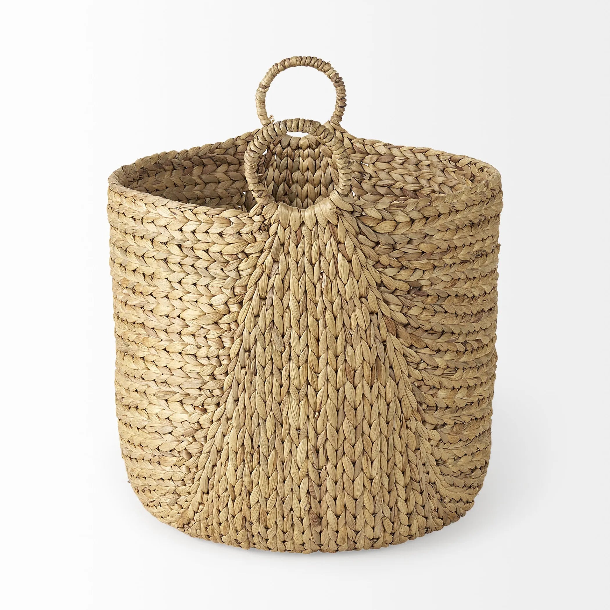 Side angle of a woven basket with round handles on a white background