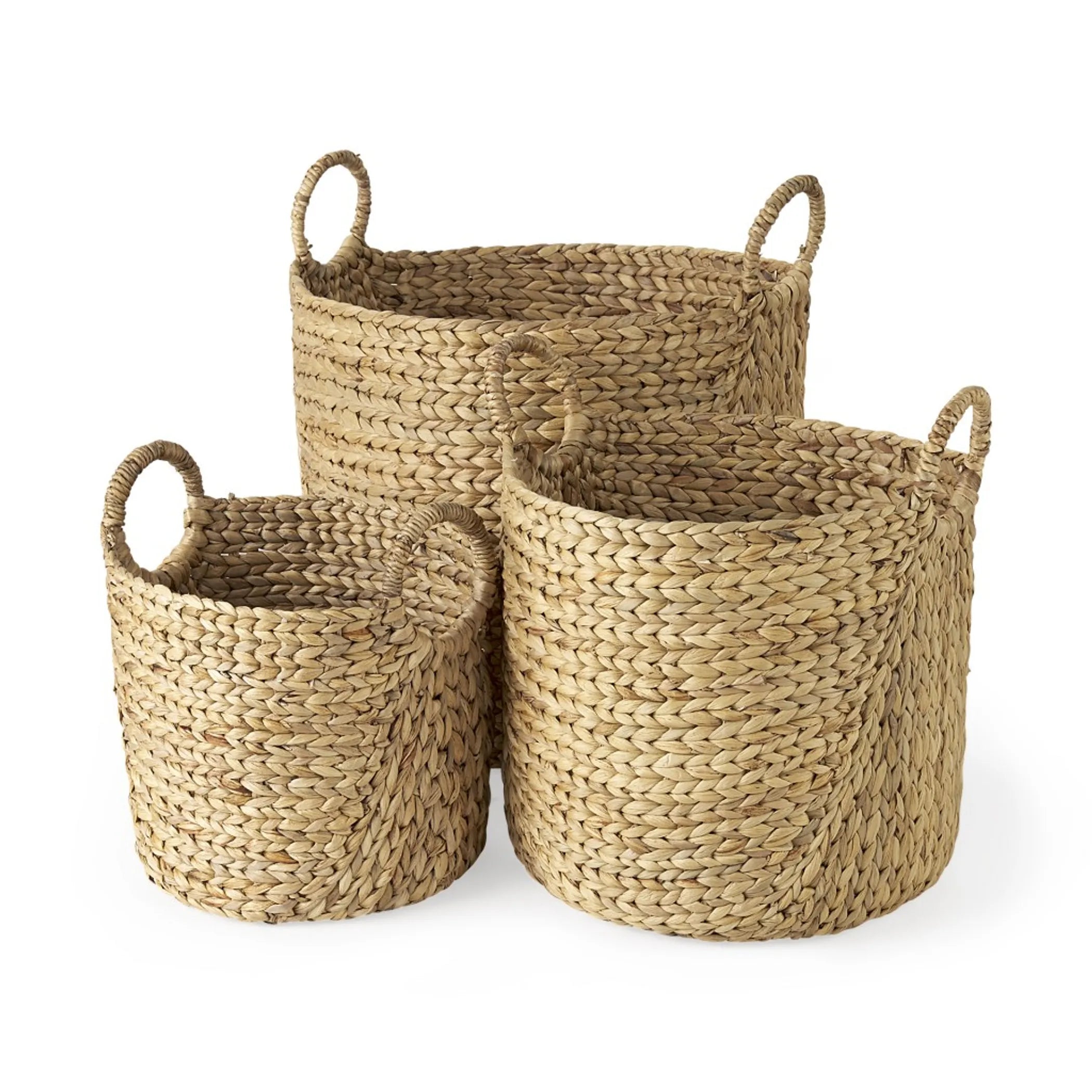 Three woven baskets of different sizes on a white background