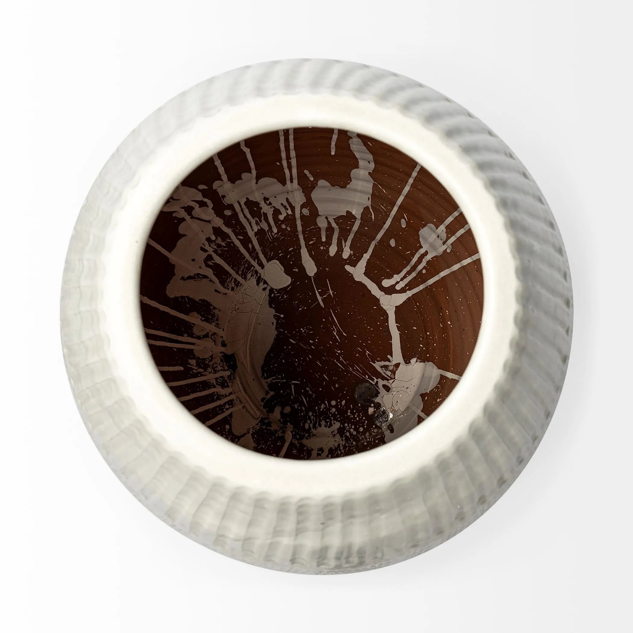 Round decorative textured vase on a white background