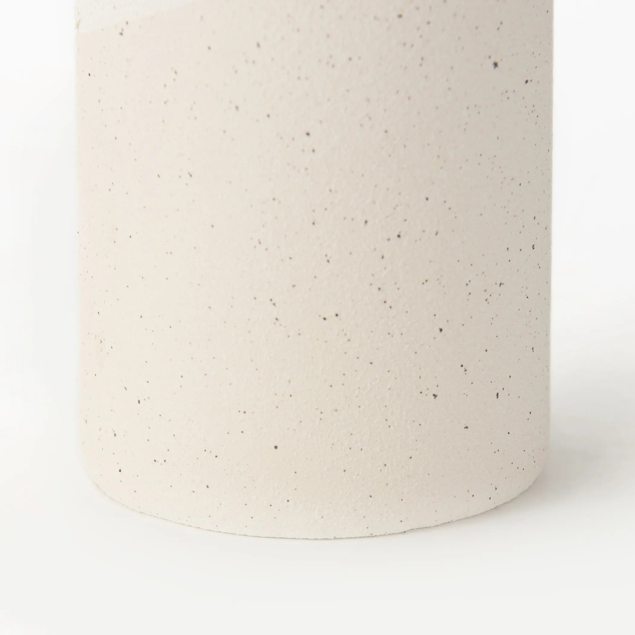 Speckled beige ceramic vase on a white background