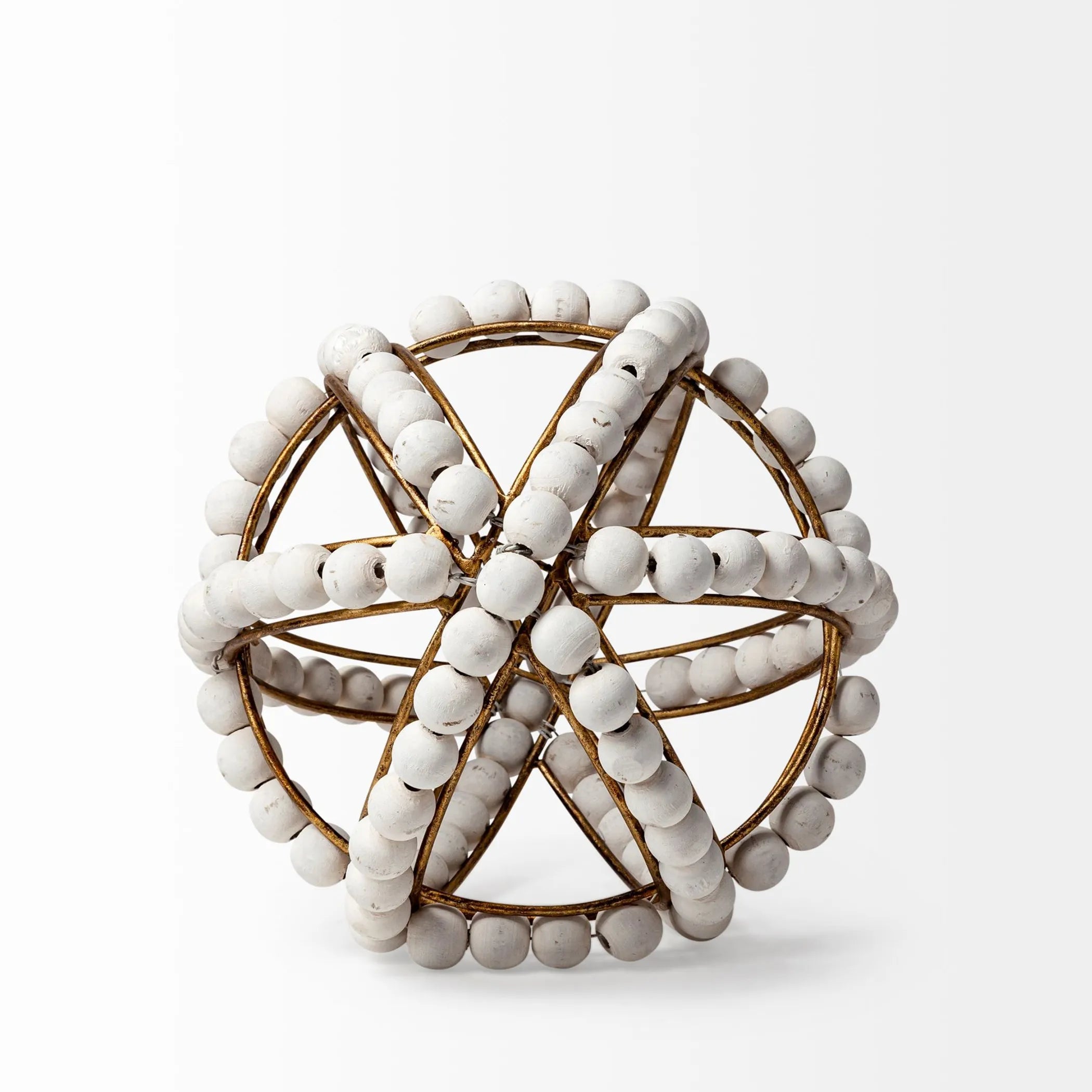 Decorative spherical object with white beads and gold wire on a white background