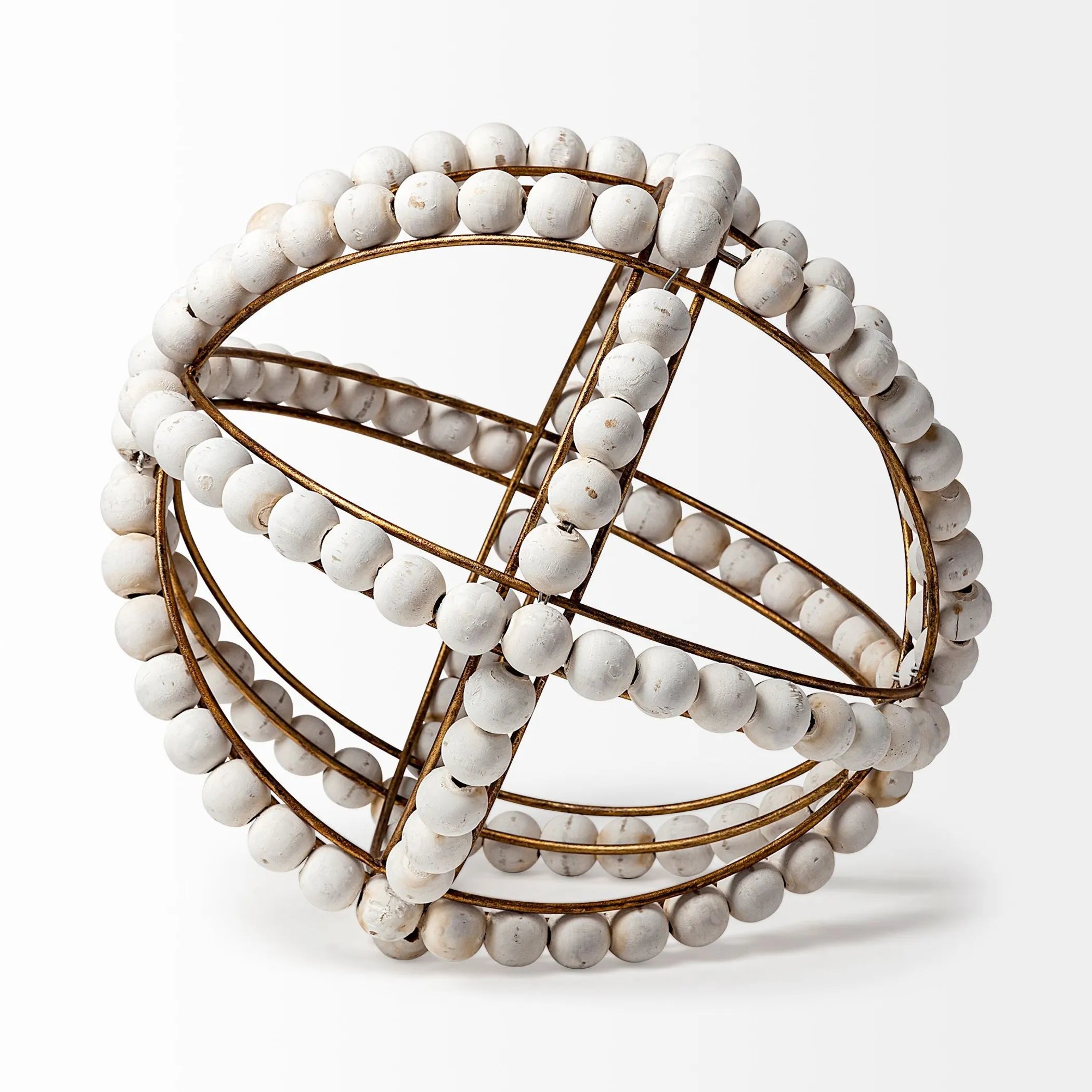 Decorative object with white beads and gold wire on a white background