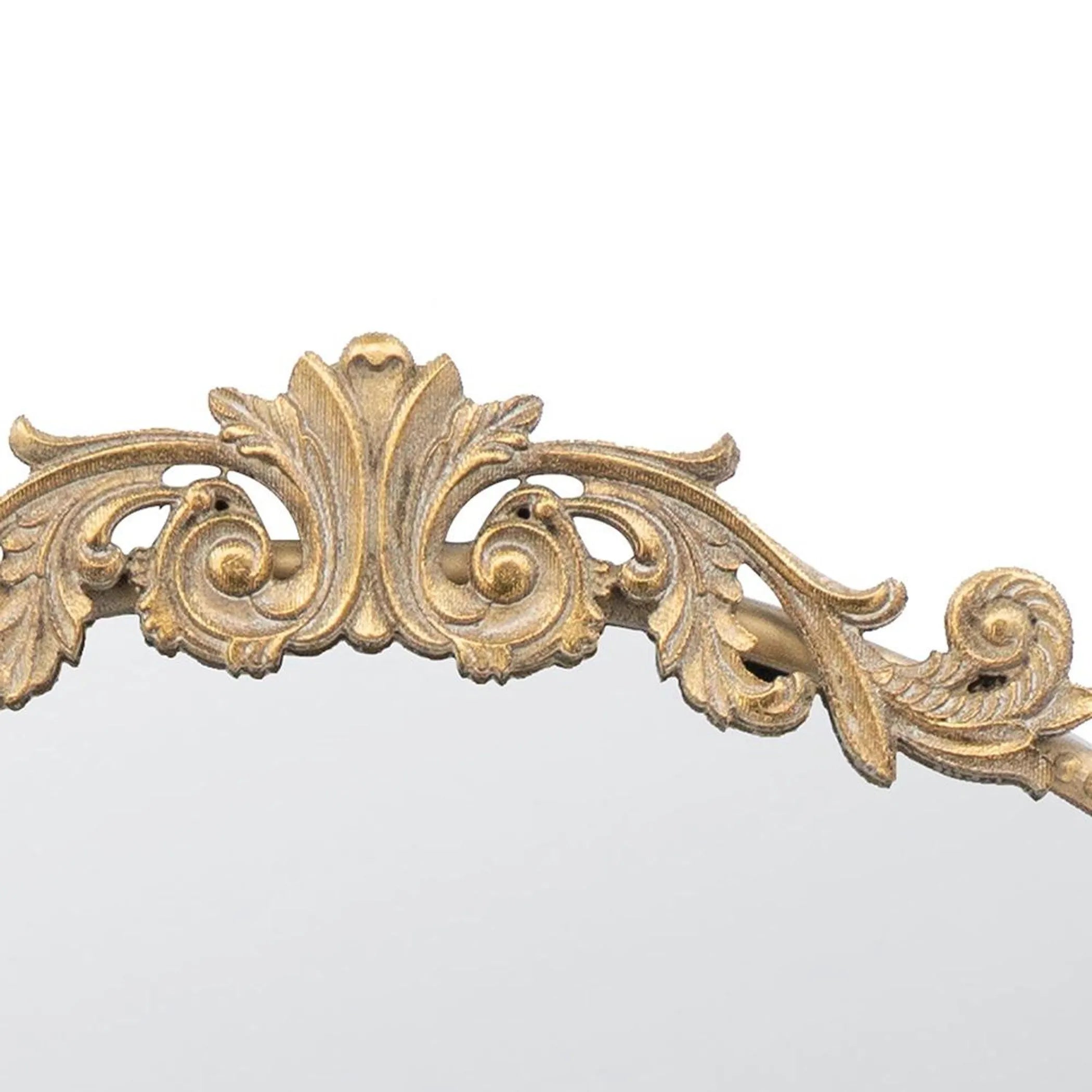 Decorative gold crown mirror top with intricate leaf patterns on a white background