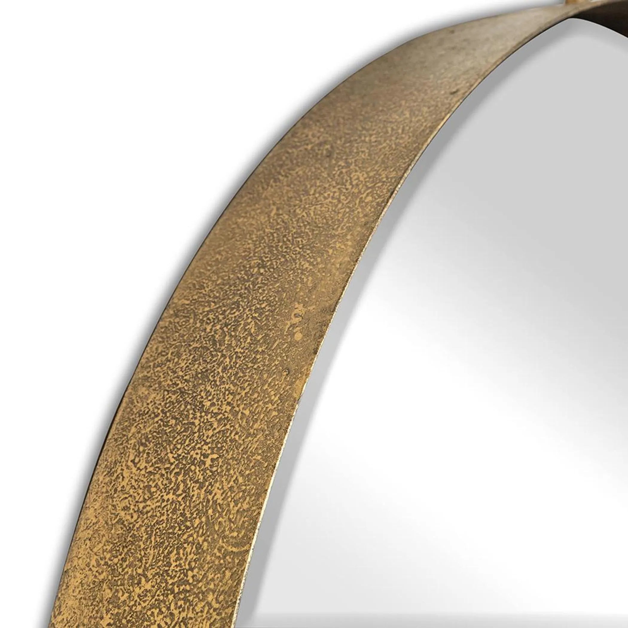 Close-up of a round mirror with a gold frame on a white background