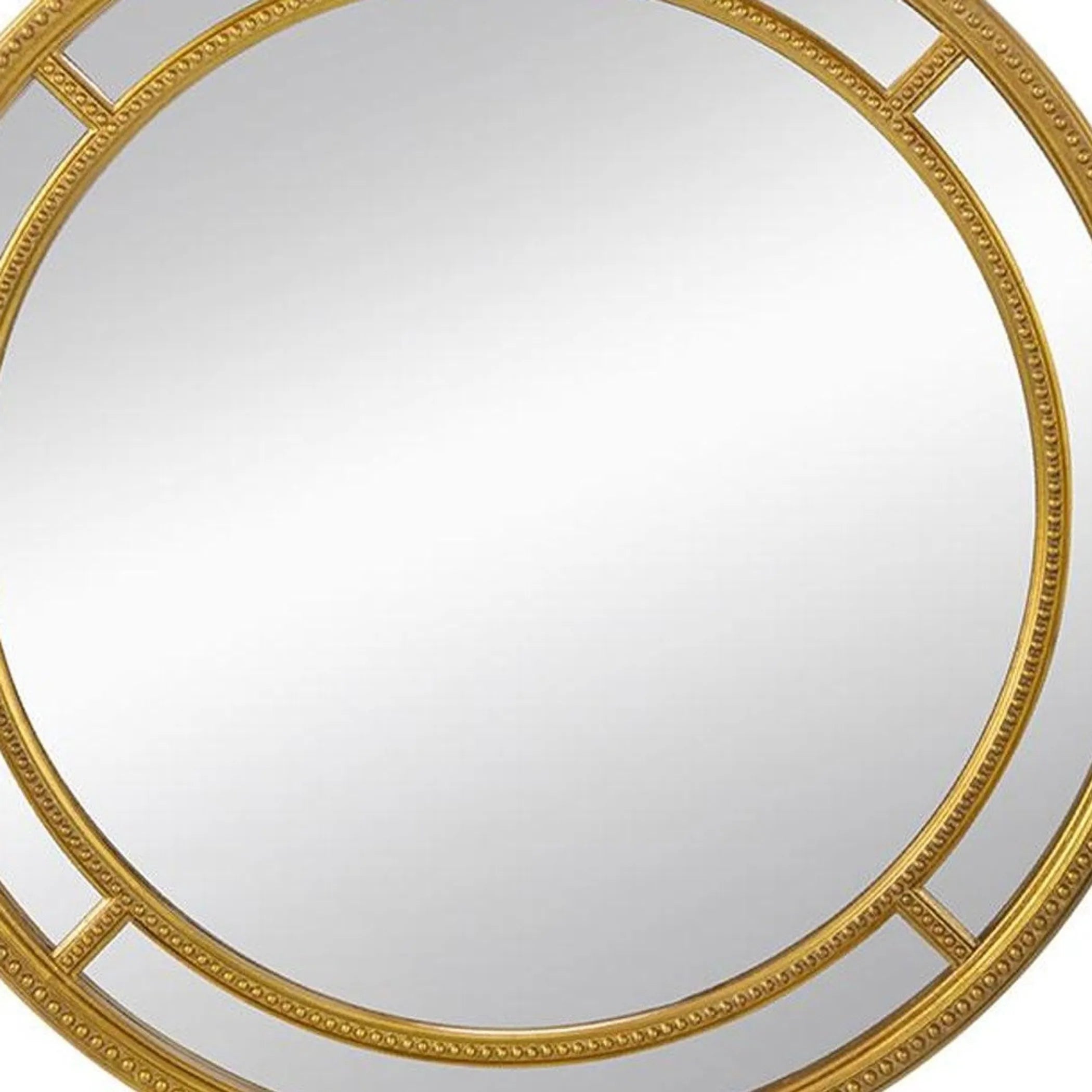 Round mirror with a gold decorative frame on a white background