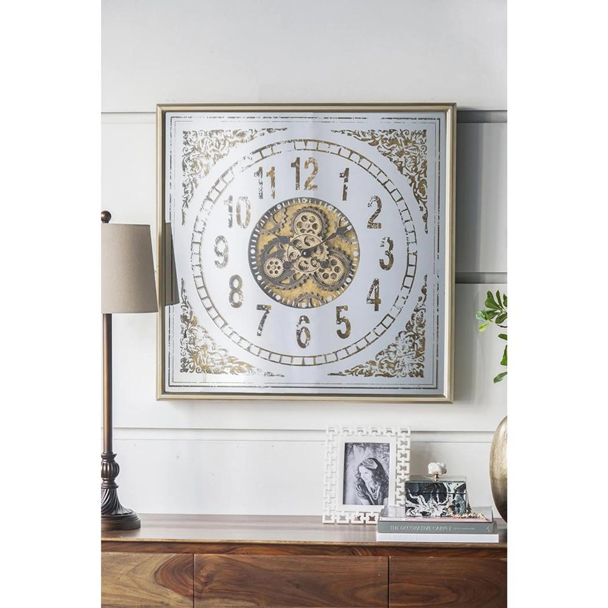 Decorative wall clock with gears on a shelf in a home setting