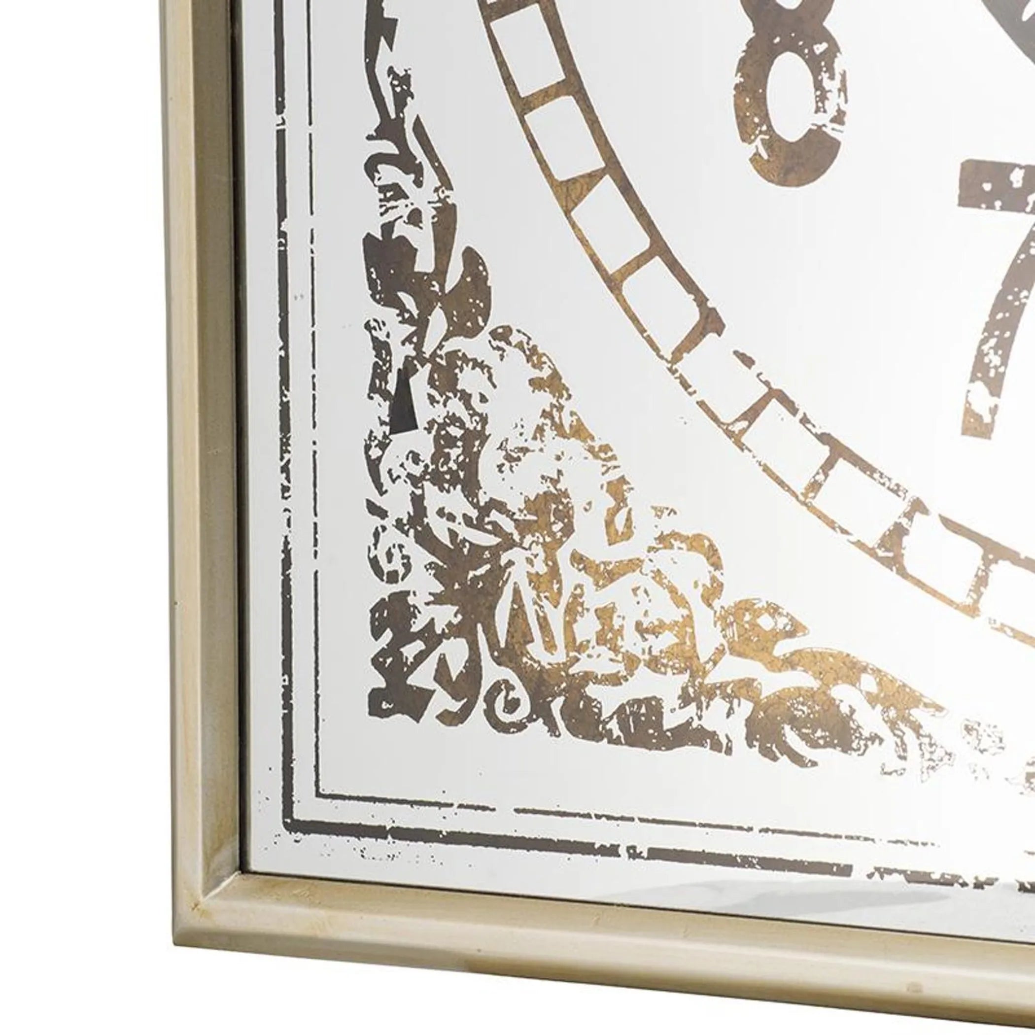 Decorative wall clock with gold and black design on a white background