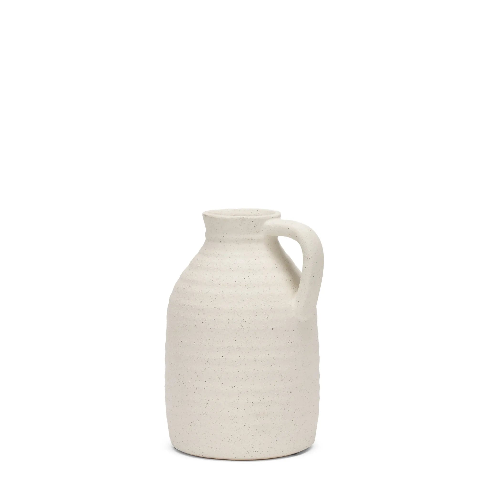 White textured ceramic pitcher on a white background