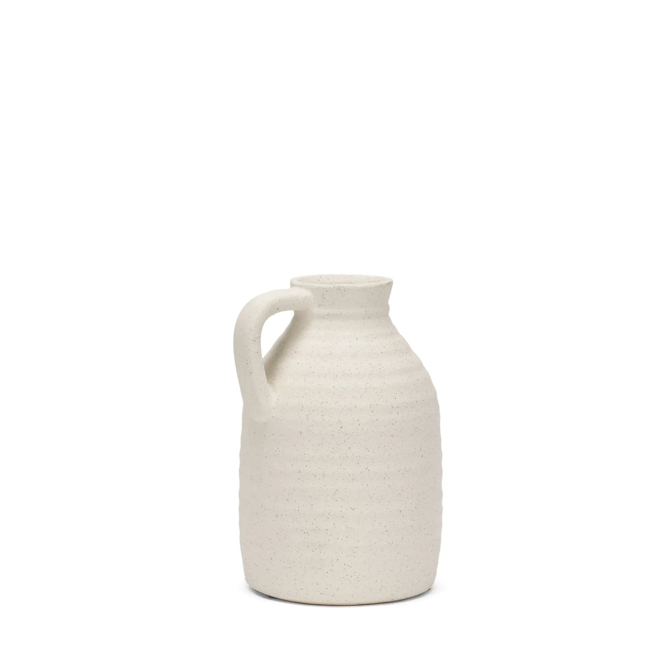 White textured ceramic pitcher on a white background