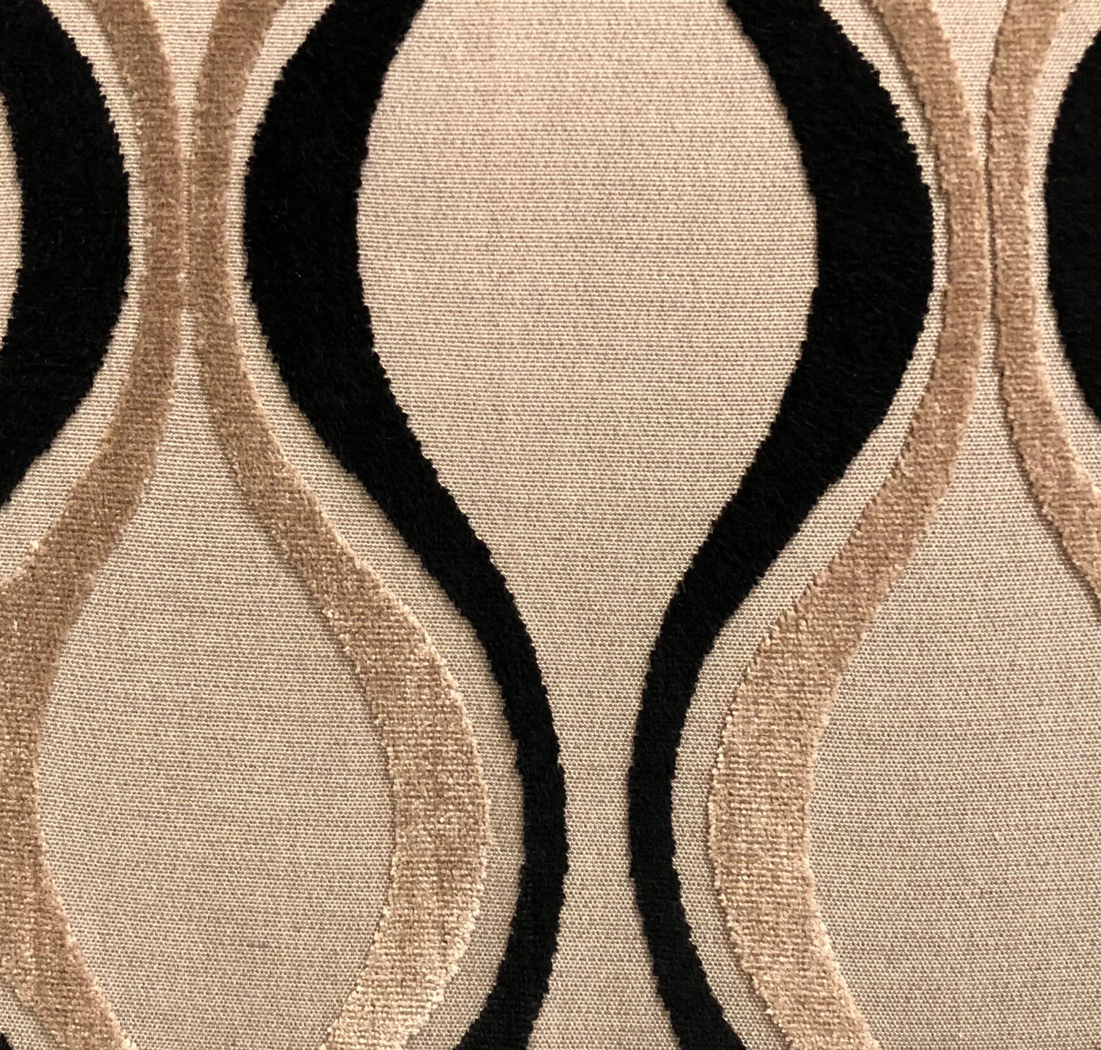 Close-up of a textured fabric with black and beige pattern