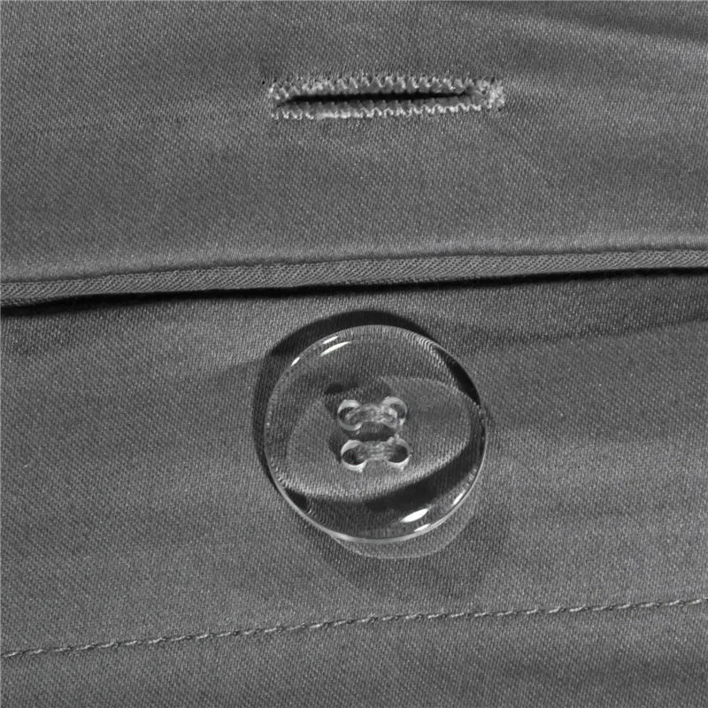 Close-up of a button on a gray fabric surface