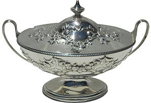 Silver decorative bowl with lid on a white background