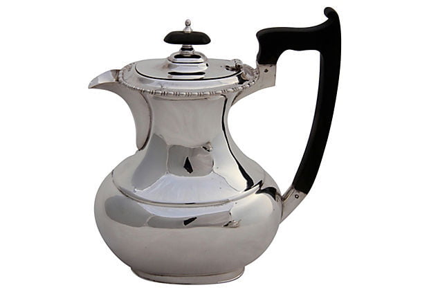 Antique Silver Coffee Pot with a black handle on a white background