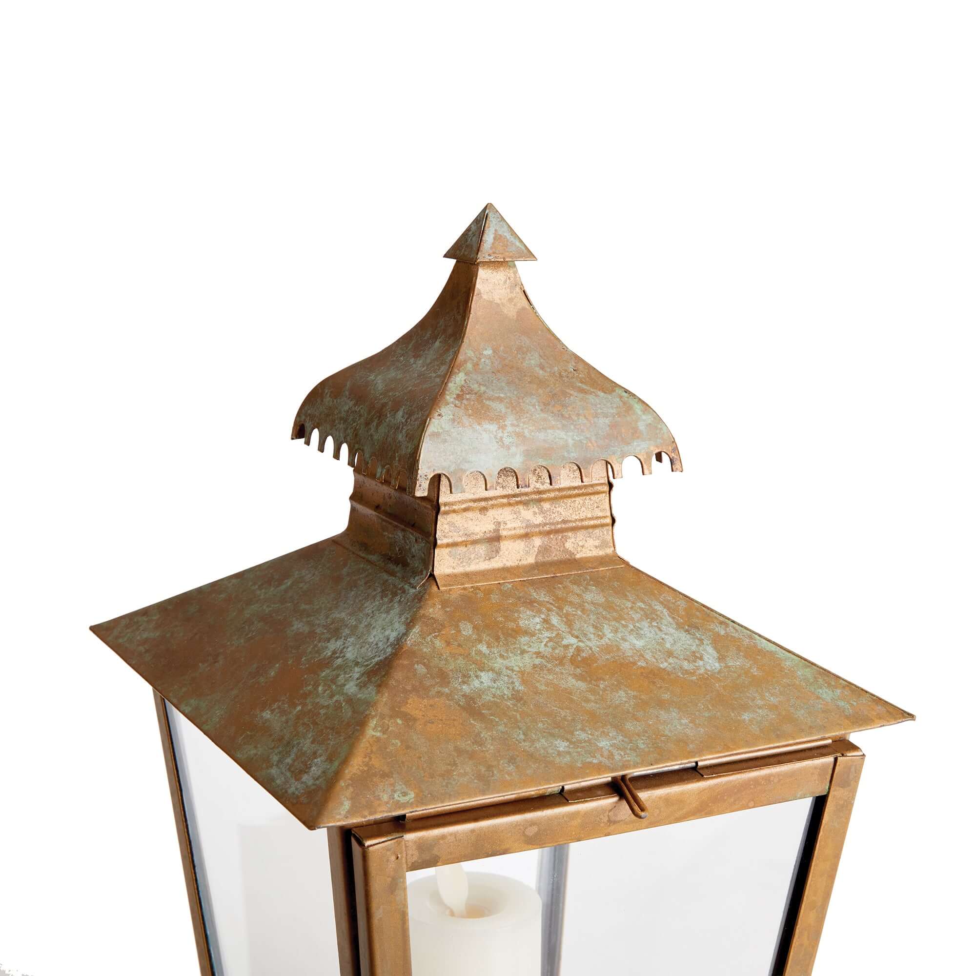 Copper lantern with a decorative roof on a white background