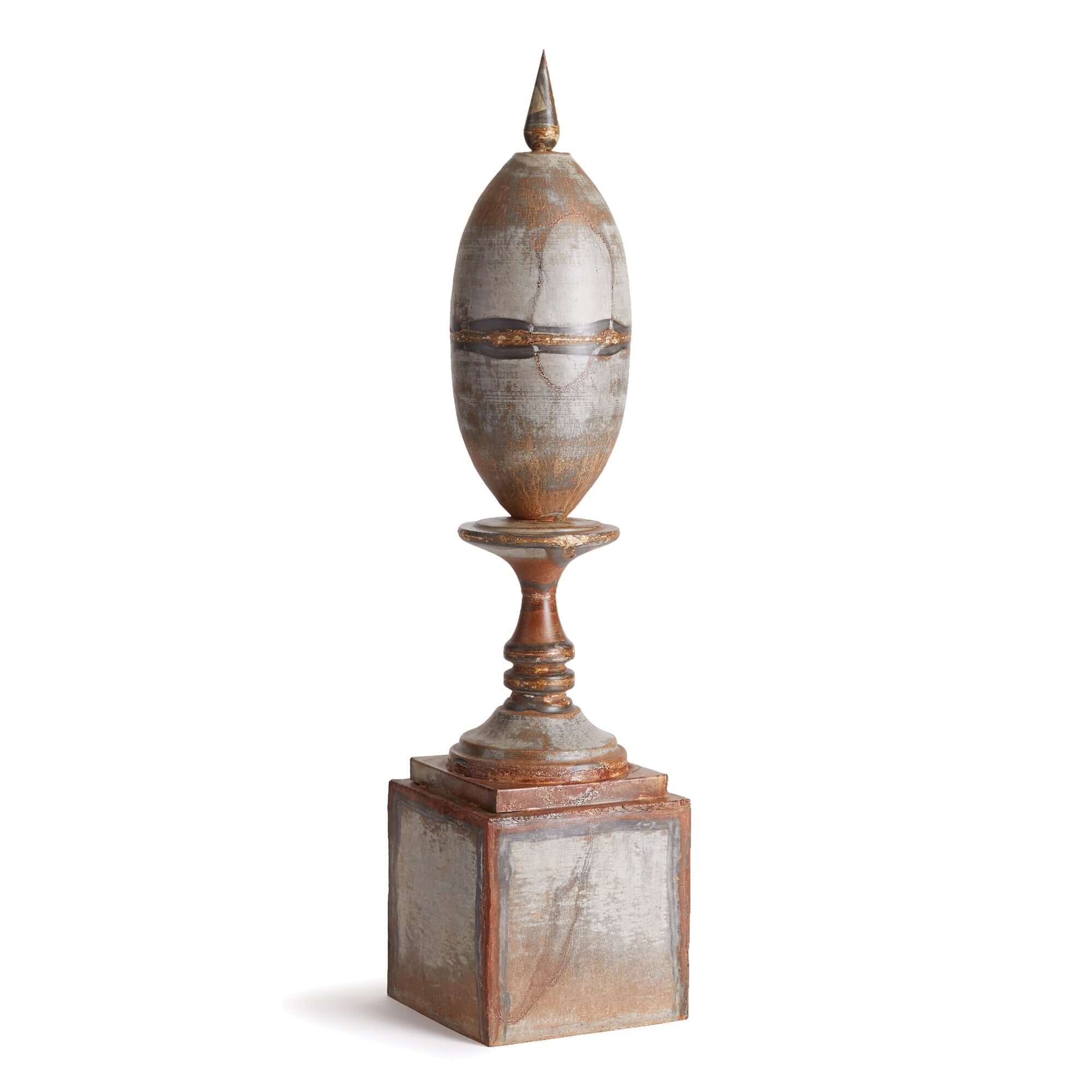 Decorative finial with a cylindrical top and square base on a white background