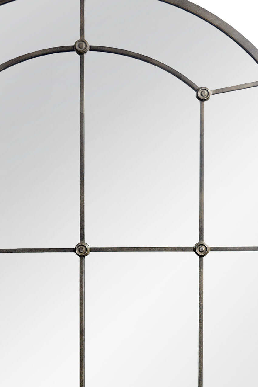 Close-up of a window with metal frame and glass panes on a white background