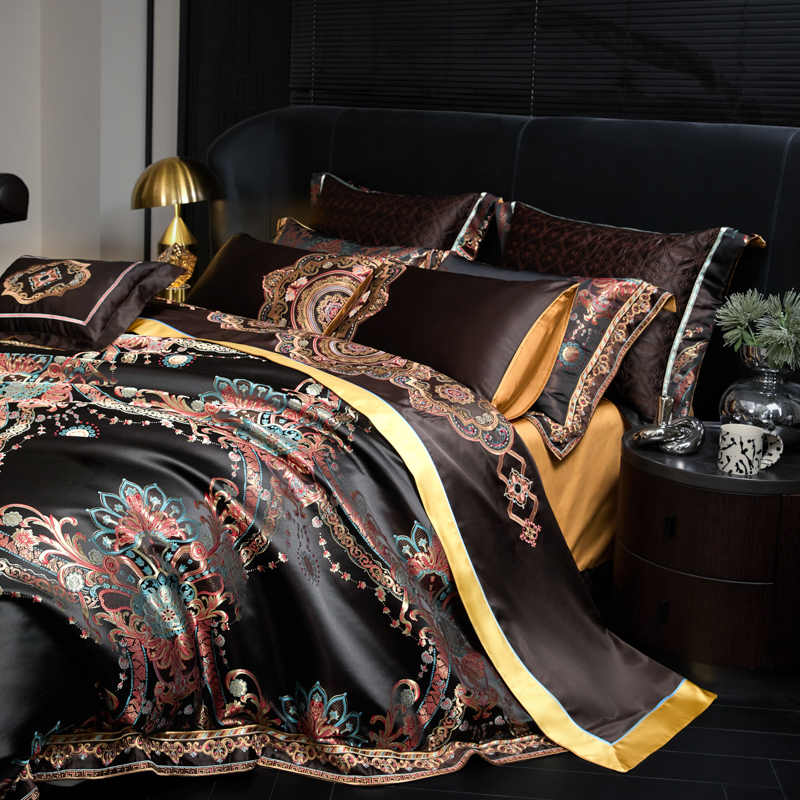 Decorative bedspread with intricate patterns on a bed in a bedroom setting.