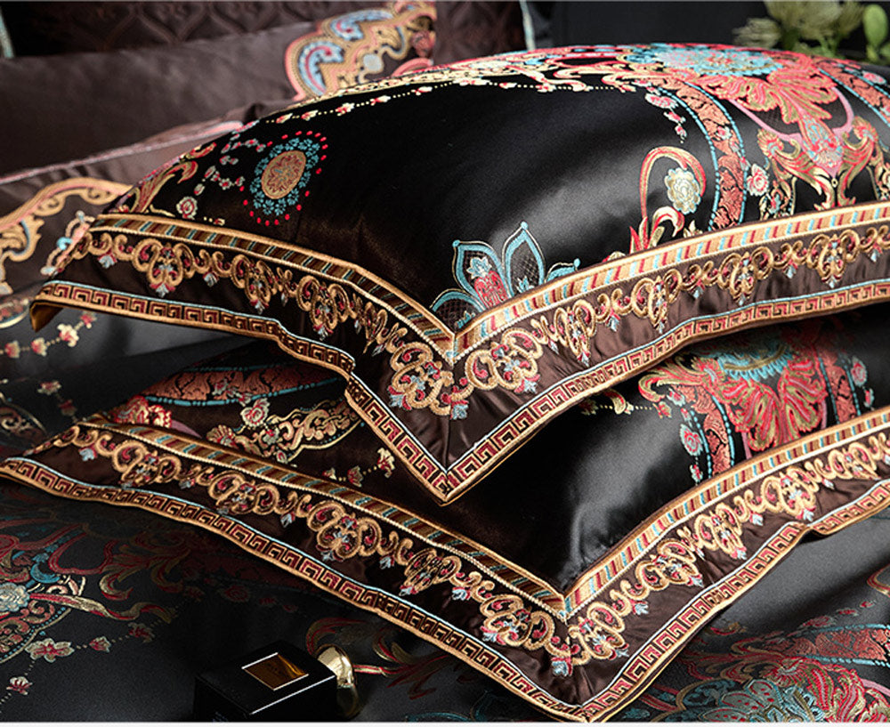 Decorative pillow with intricate embroidery on a dark background