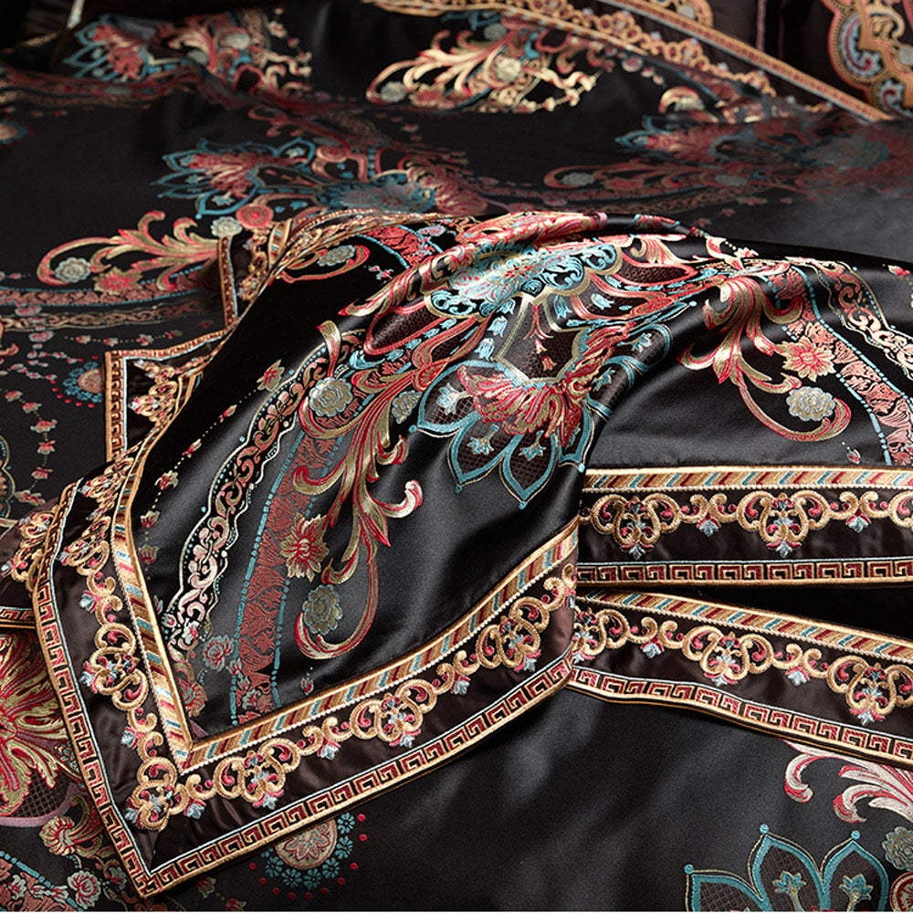 Close-up of an intricately designed fabric with colorful patterns on a black background
