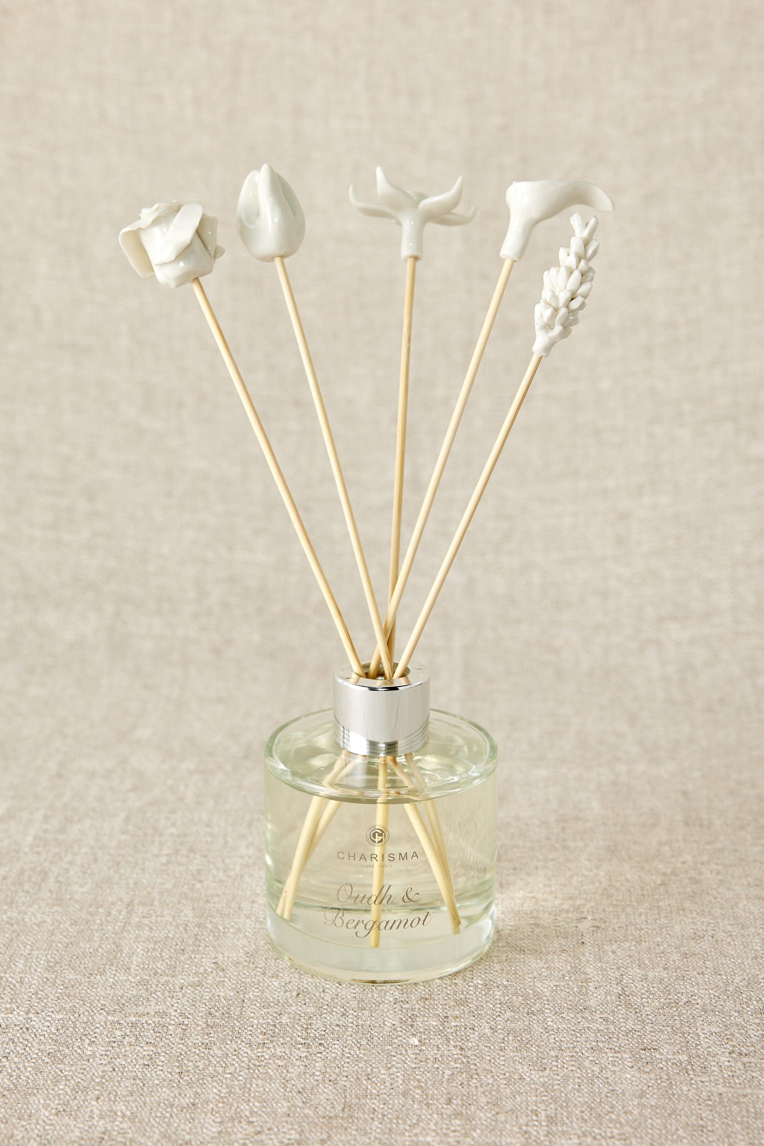 Diffuser with decorative sticks on a beige background
