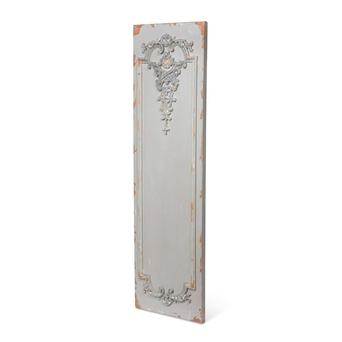 Side angle of a decorative wall plaque with intricate patterns on a white background