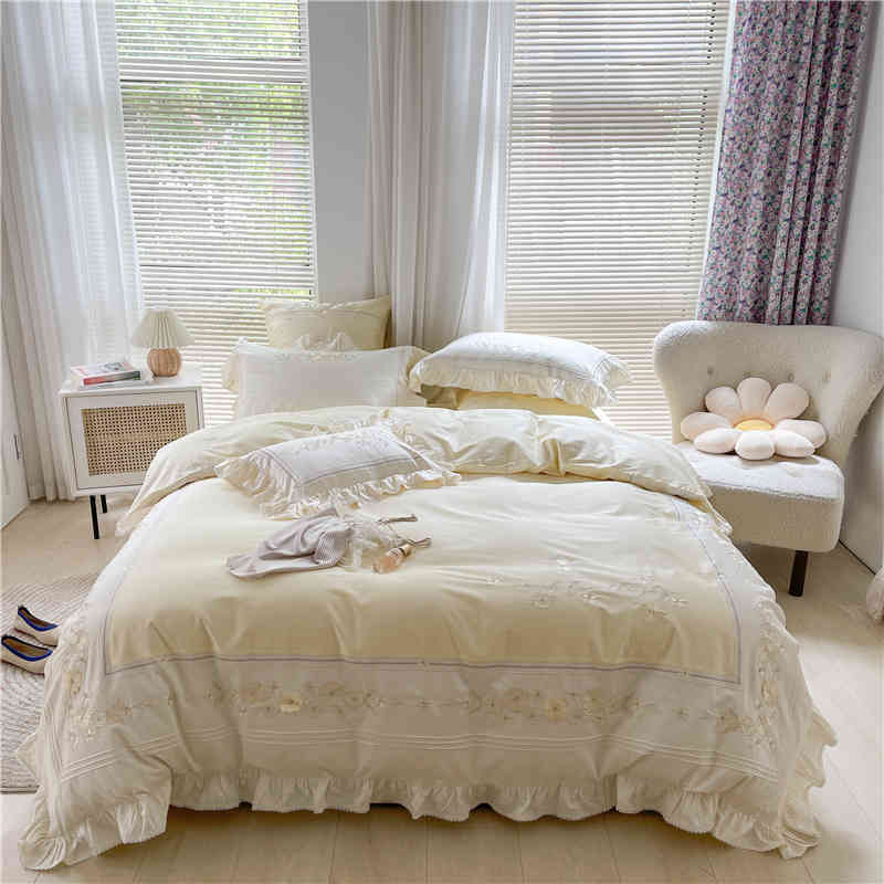 Neatly made bed with white bedding in a bright bedroom