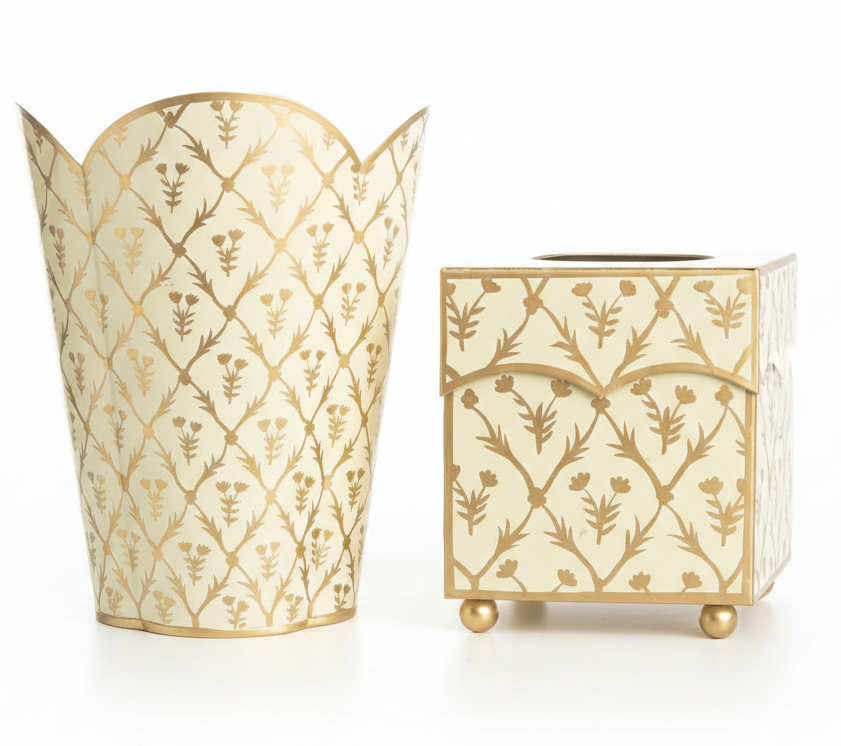 Decorative trash can and tissue box holder with gold floral patterns on a white background