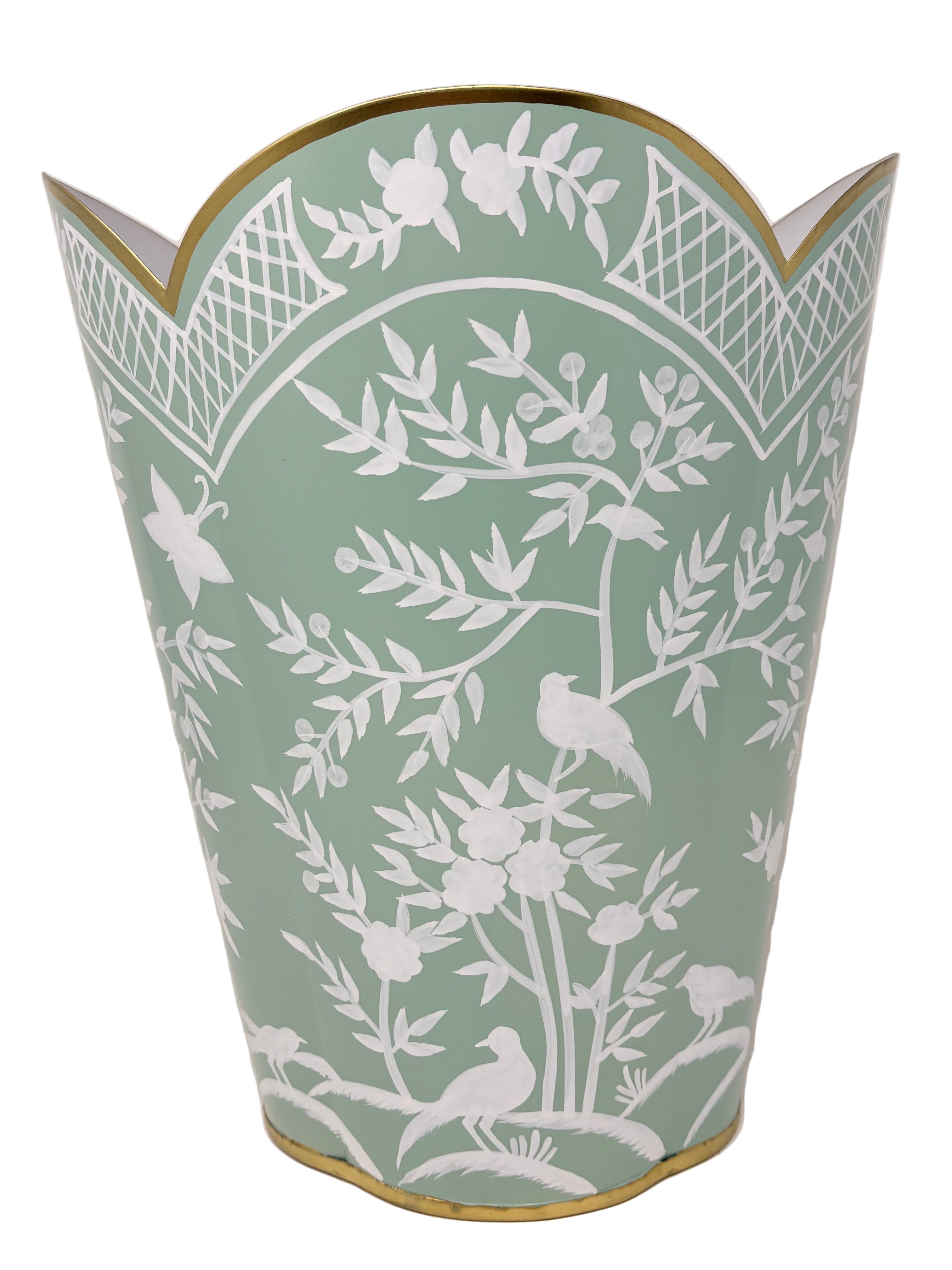 Decorative trash bin with white floral and bird pattern on a green background
