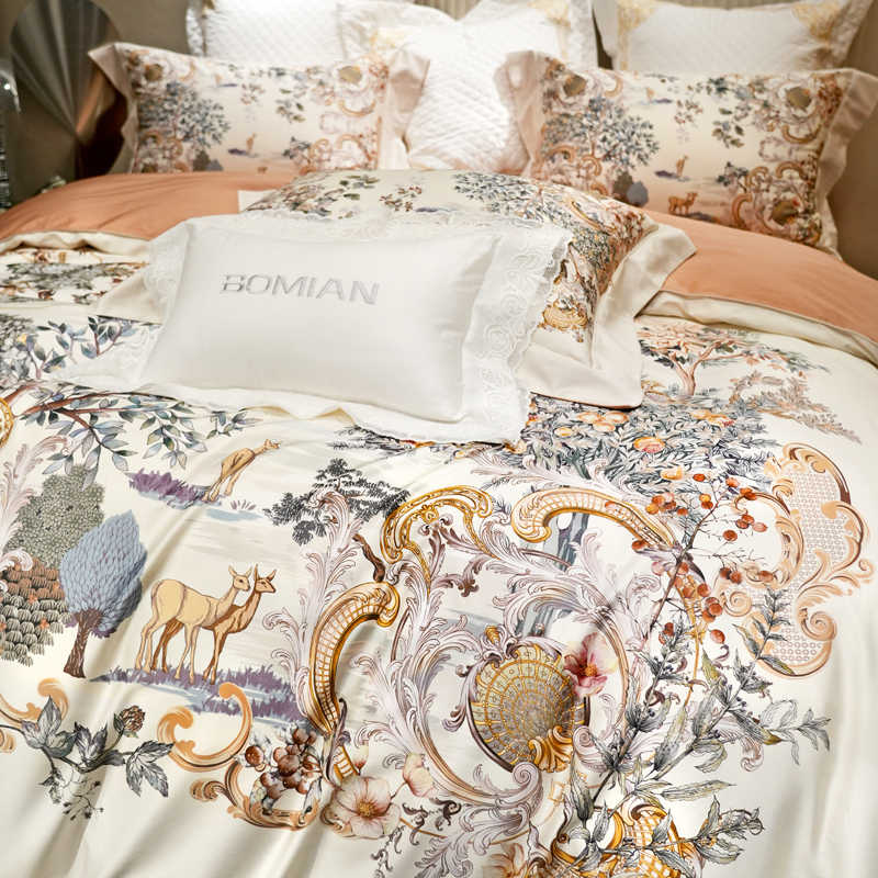 Decorative bedspread with floral and animal patterns on a bed, featuring the brand 'Bomian'.