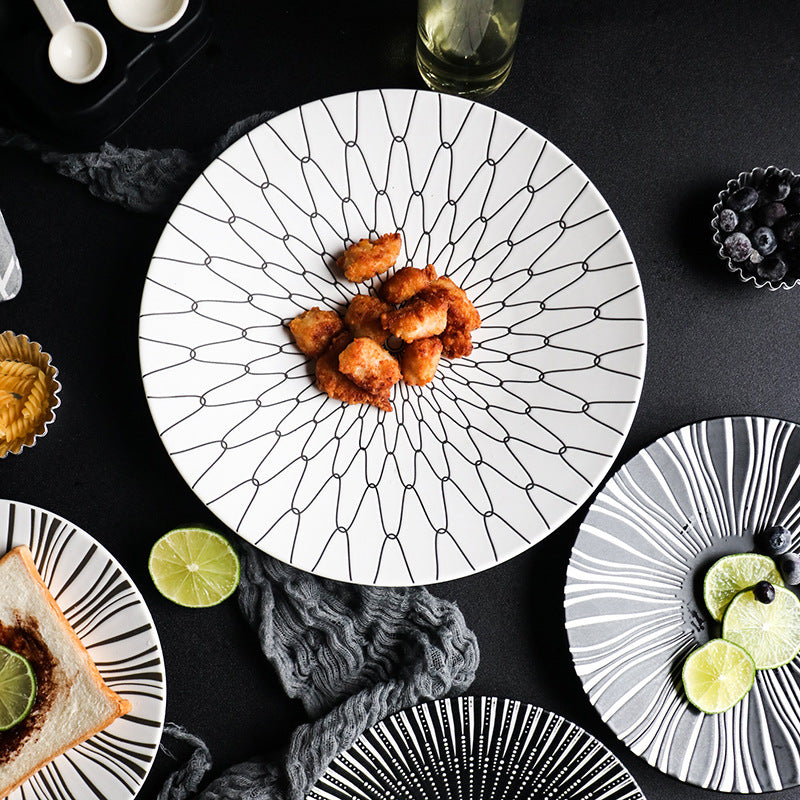 Decorative plates with food on a black surface