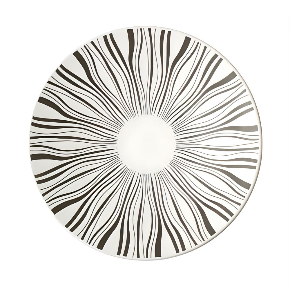 Round plate with black and white concentric circle pattern on a white background