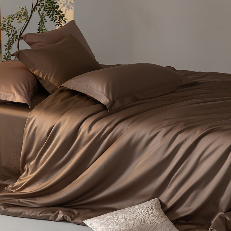 Brown satin bedding set on a bed with a neutral background