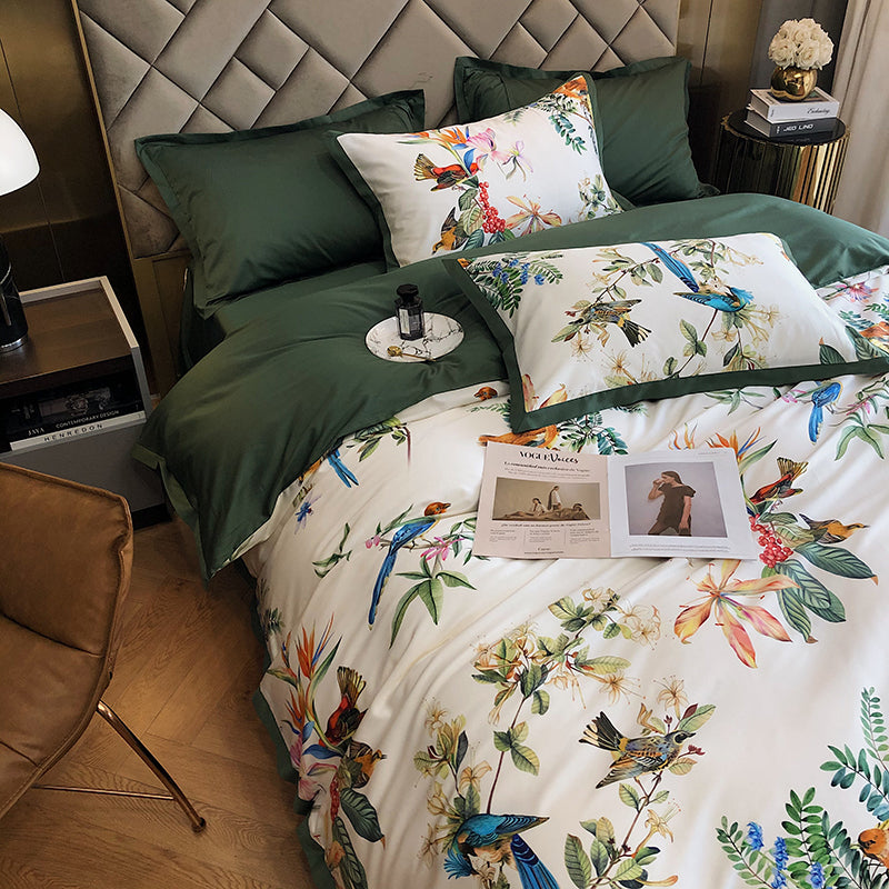 Bed with floral and bird patterned bedding in a bedroom setting.