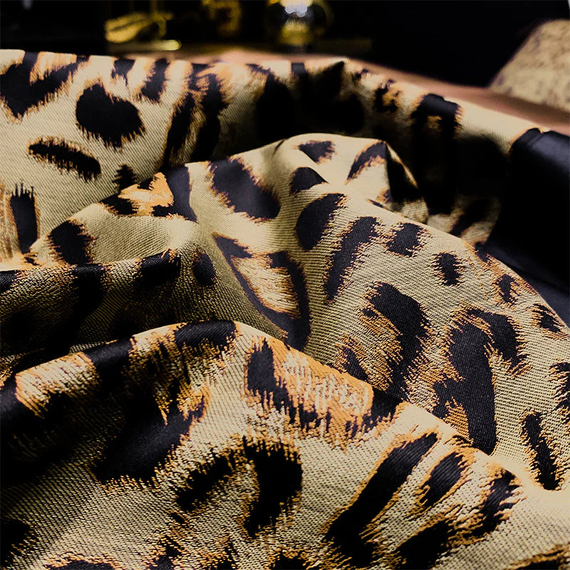 Close-up of leopard print bedding fabric with a blurred background