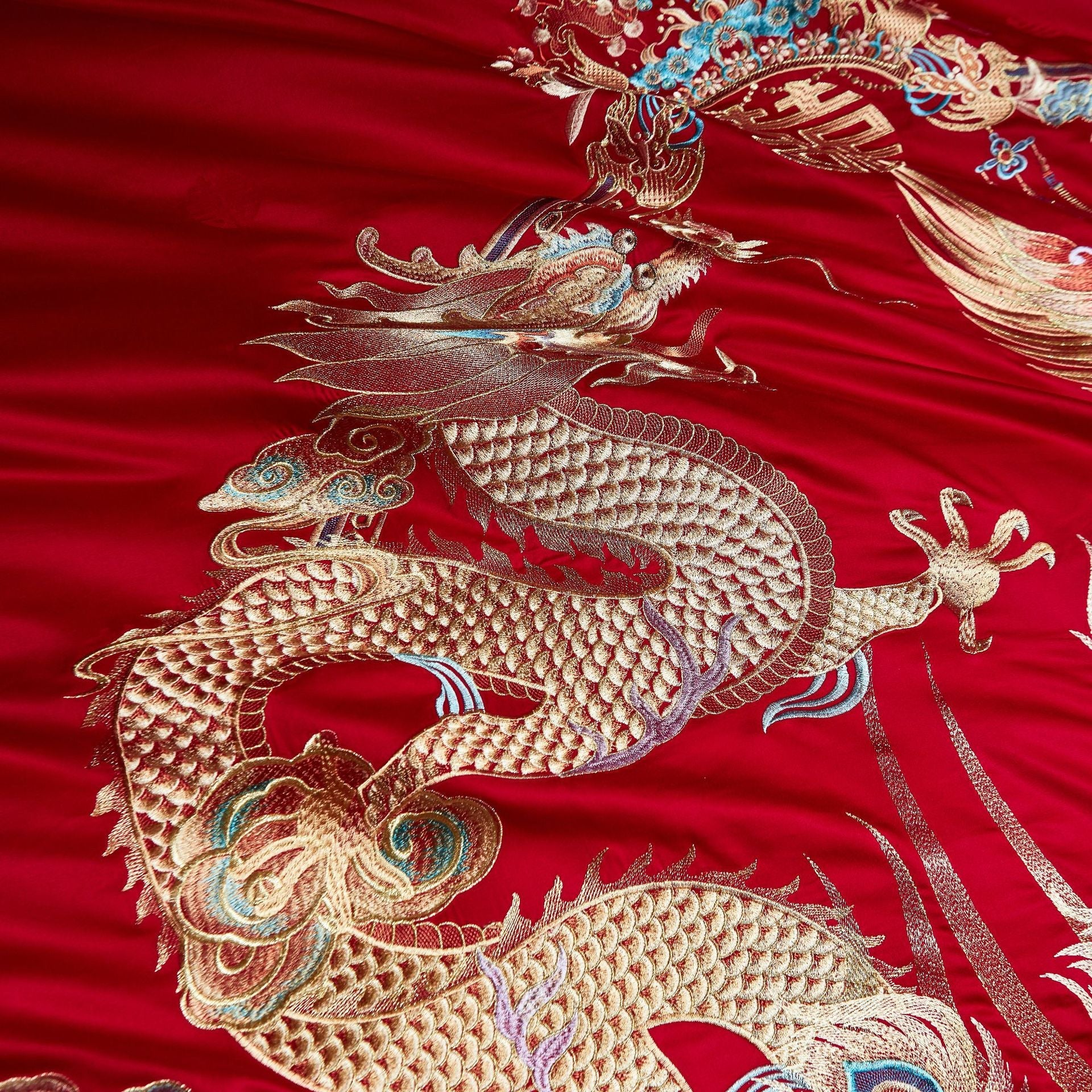 Embroidered dragon design on red fabric