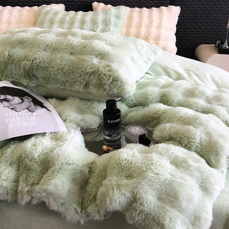 Green faux rabbit fur bedding with a bottle of Selvage and a magazine on a bed.