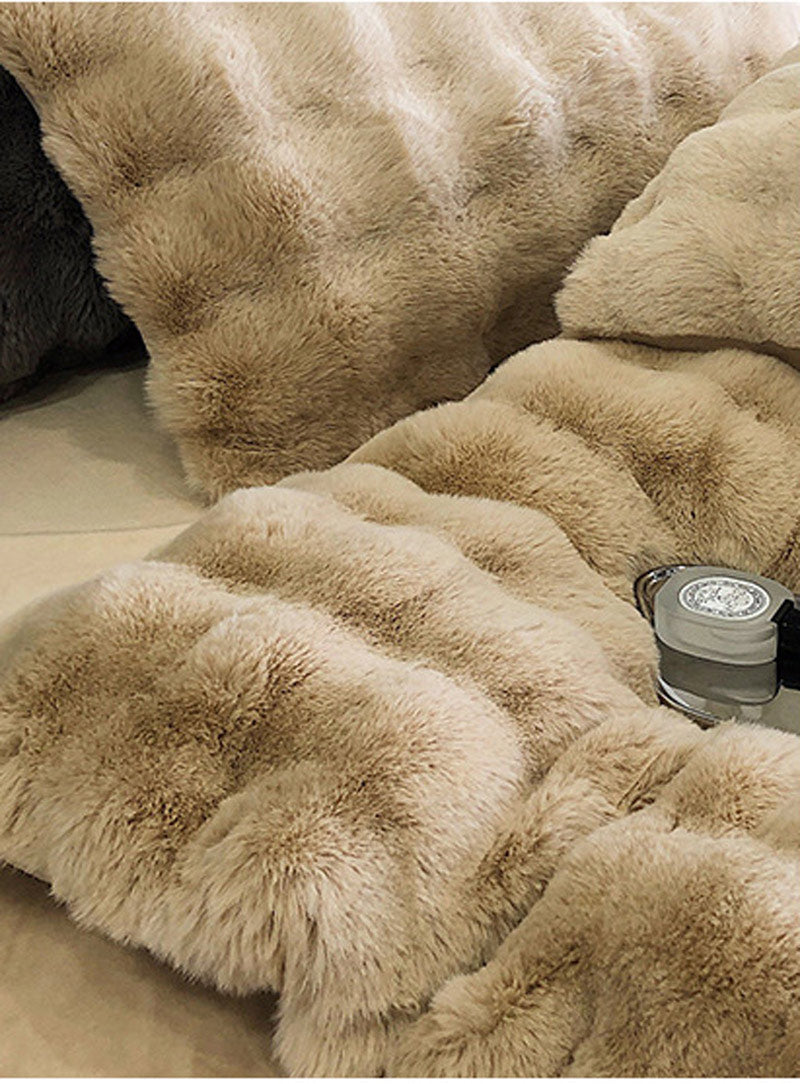 Close-up of a fluffy beige rug with a light source on a neutral background