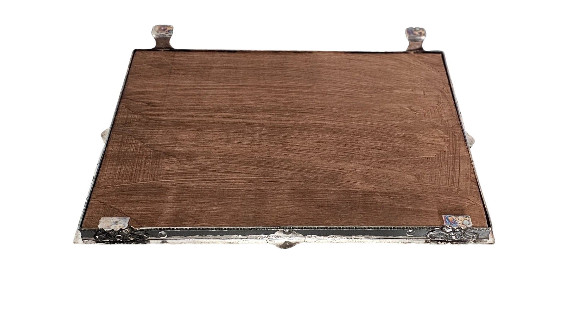 underside of a mirror plateau silver plated on a white background