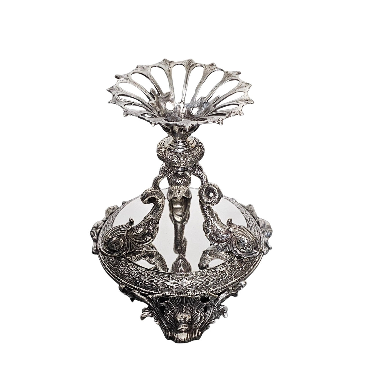 Decorative silver bowl with intricate designs on a white background