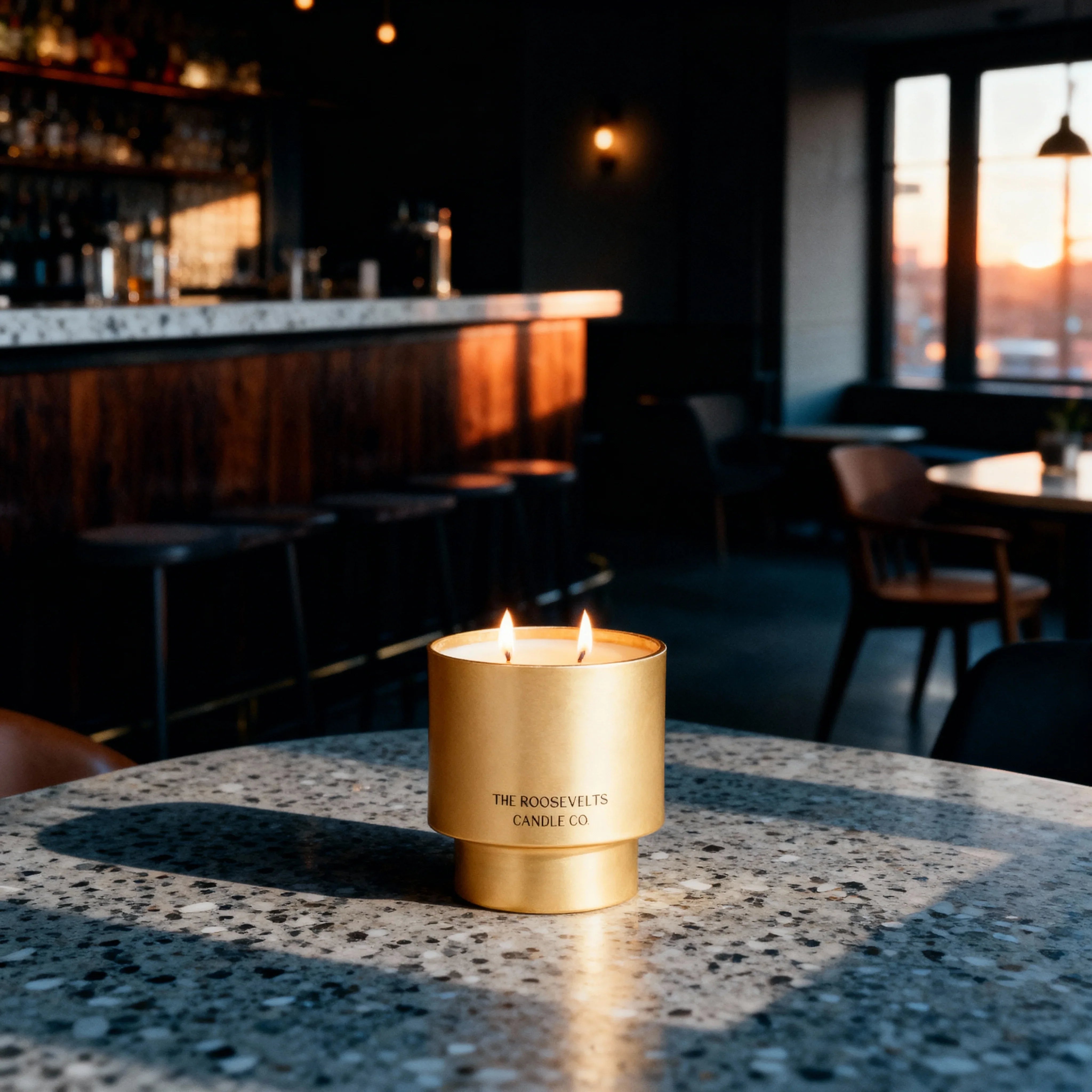 Gold candle in a bar setting with warm lighting