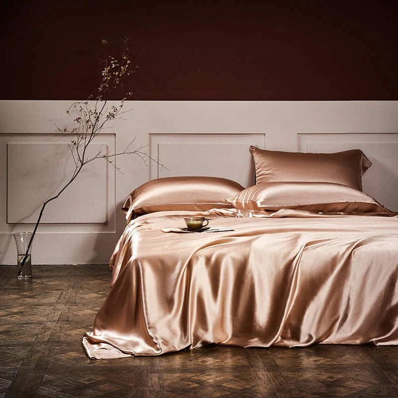 Rose gold bedding set on a bed in a bedroom setting.