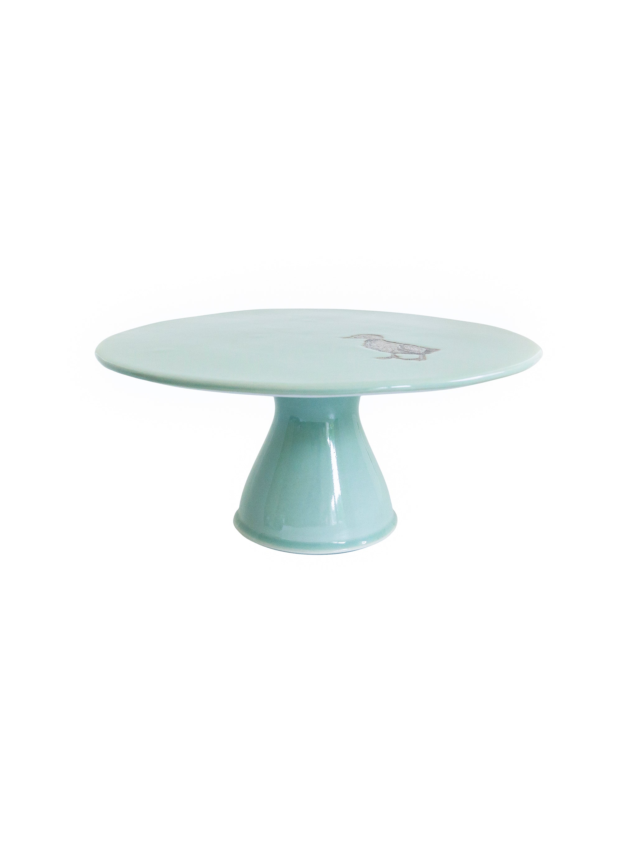 Light blue cake stand with a duck motif on a white background