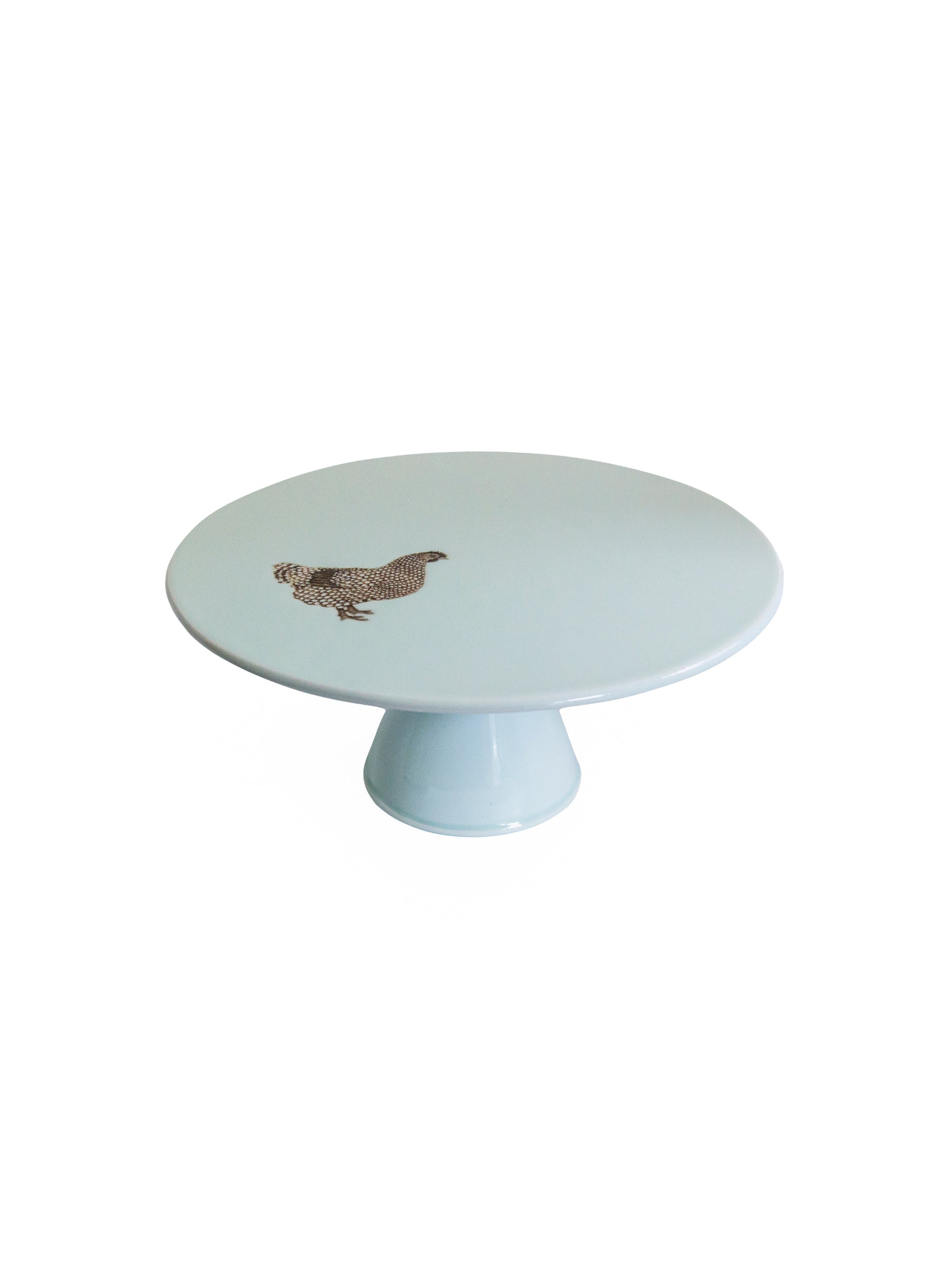 Round cake stand with a hen design on a white background