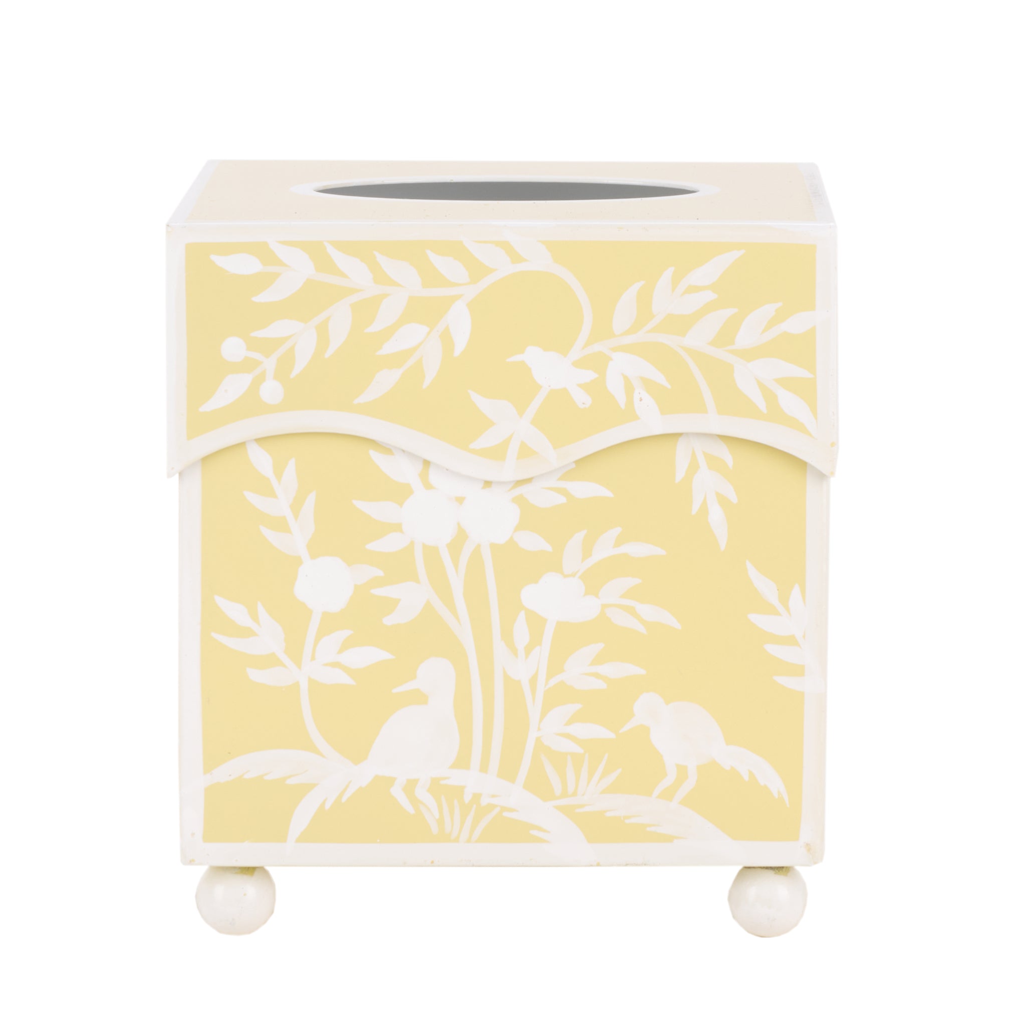 Yellow tissue box cover with white bird and branch pattern on a white background