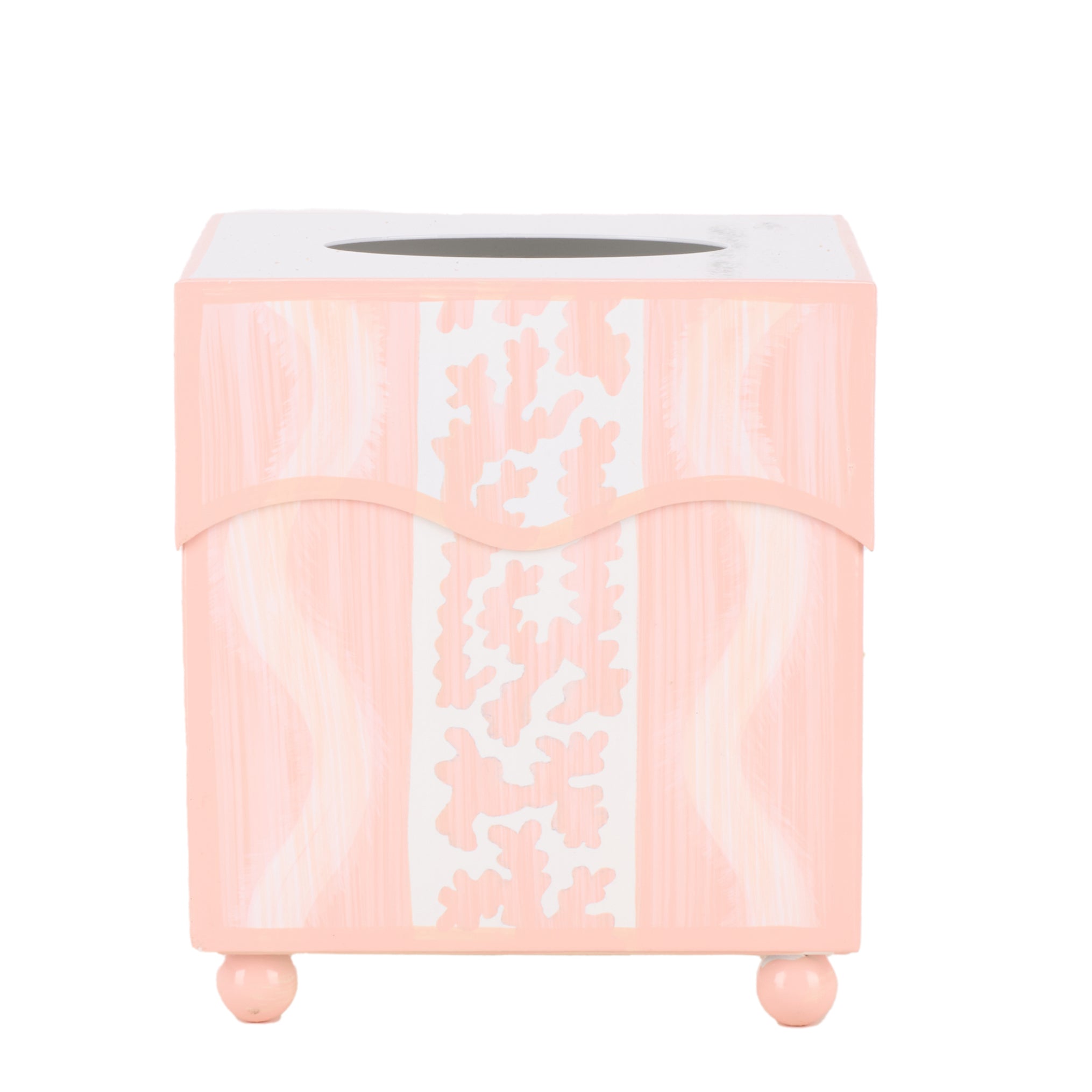 Pink decorative tissue box with white floral patterns on a white background