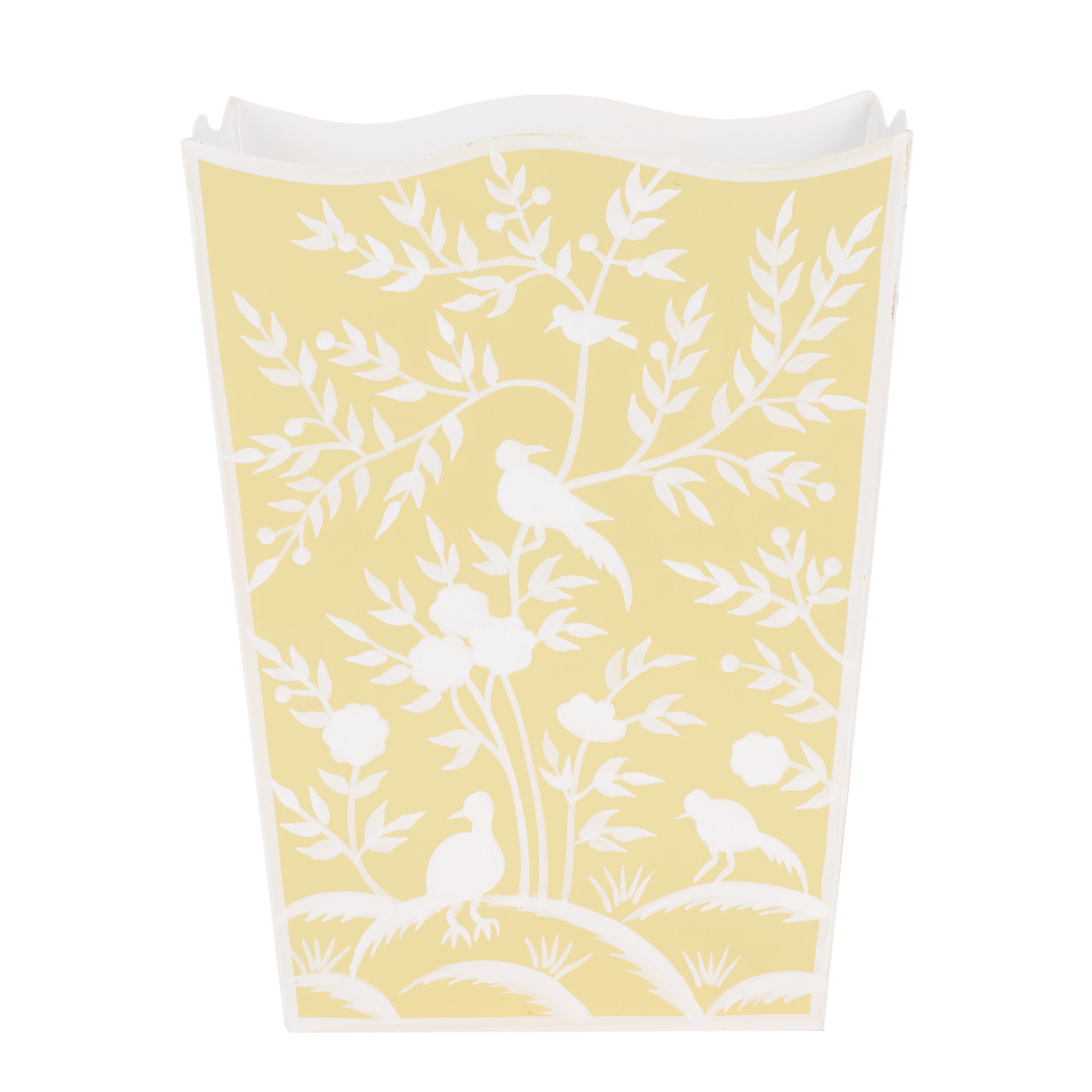 Yellow wastepaper basket with white bird and leaf pattern on a white background